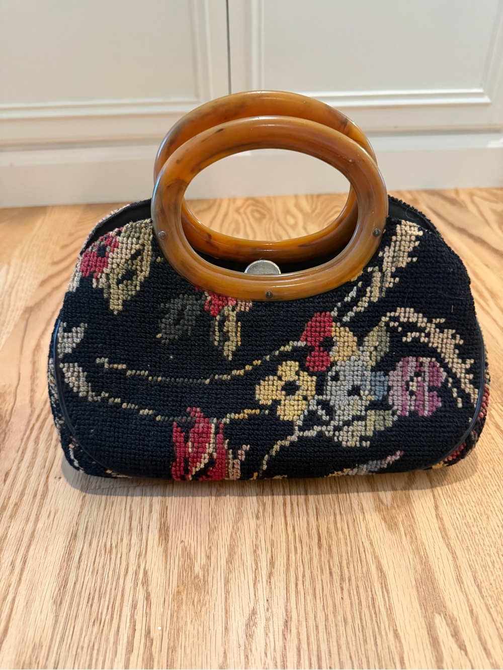 Vintage-Inspired Black Floral Tapestry Handbag with Amber Handles